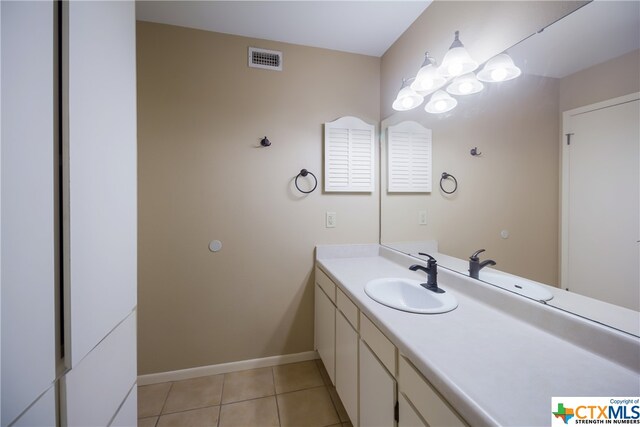 bathroom with vanity and tile patterned floors