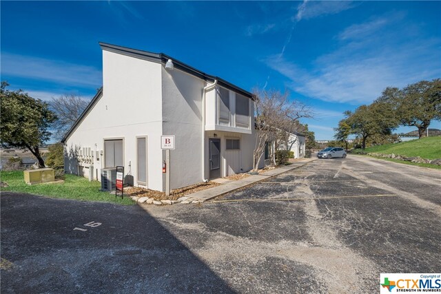 exterior space featuring central AC unit