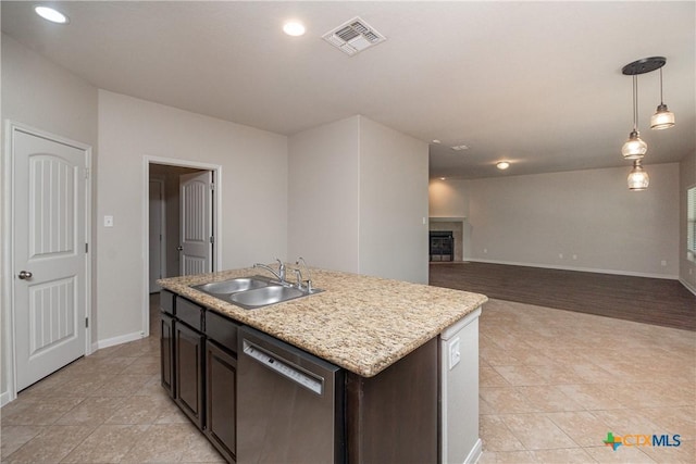 253 Flushing, New Braunfels, TX 78130 - kitchen featuring visible vents, light tile patterned floors, baseboards, a sink, and stainless steel dishwasher