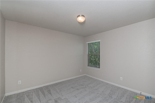 253 Flushing, New Braunfels, TX 78130 - carpeted empty room featuring baseboards