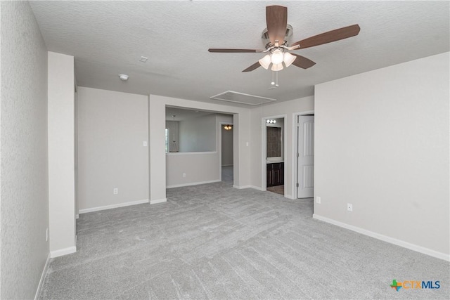 253 Flushing, New Braunfels, TX 78130 - carpeted empty room featuring baseboards, a ceiling fan, attic access, and a textured ceiling