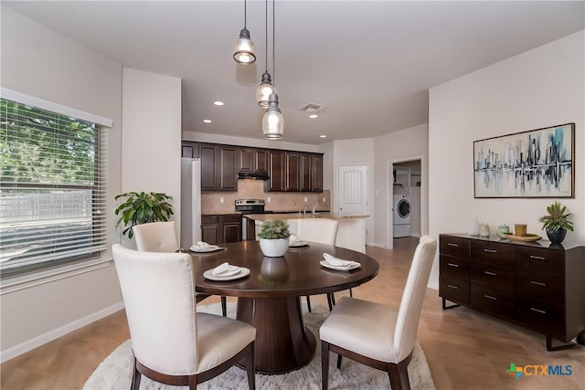 253 Flushing, New Braunfels, TX 78130 - dining area featuring baseboards, recessed lighting, visible vents, light wood finished floors, and washing machine and clothes dryer