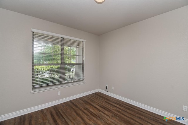 253 Flushing, New Braunfels, TX 78130 - spare room with baseboards and dark wood finished floors