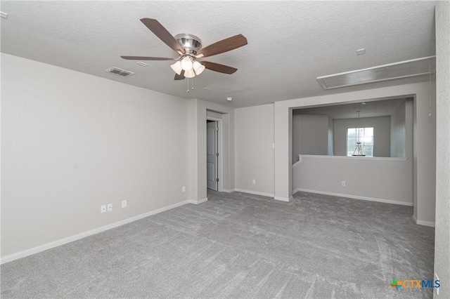 253 Flushing, New Braunfels, TX 78130 - spare room with a textured ceiling, attic access, a ceiling fan, and visible vents