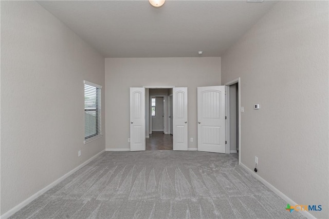 253 Flushing, New Braunfels, TX 78130 - unfurnished bedroom featuring carpet floors and baseboards