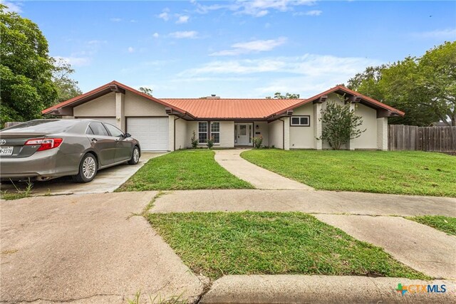 111 Warwick Glen St, Victoria, TX 77904 - ranch-style home featuring an attached garage, concrete driveway, and a metal roof