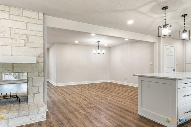 111 Warwick Glen St, Victoria, TX 77904 - kitchen featuring light countertops, dark wood-style floors, a chandelier, hanging light fixtures, and recessed lighting