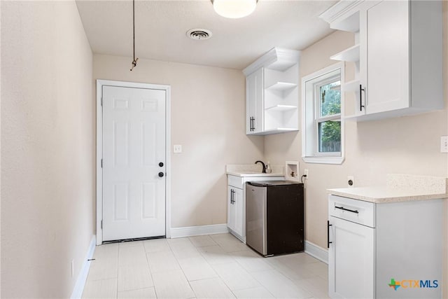 111 Warwick Glen St, Victoria, TX 77904 - washroom featuring hookup for a washing machine, cabinet space, and electric dryer hookup