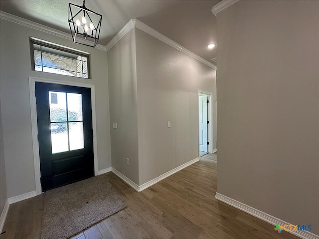 2032 Yarrow Rd, Temple, TX 76502 - entryway featuring a chandelier, wood finished floors, plenty of natural light, and ornamental molding