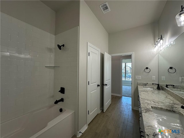 2032 Yarrow Rd, Temple, TX 76502 - full bath with bathtub / shower combination, double vanity, and wood finished floors