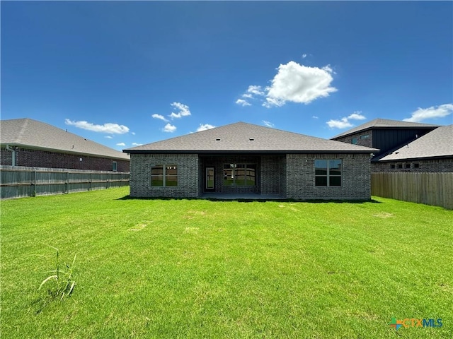 2032 Yarrow Rd, Temple, TX 76502 - rear view of house featuring a fenced backyard and brick siding