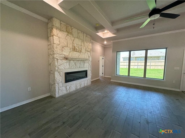 2032 Yarrow Rd, Temple, TX 76502 - unfurnished living room with a fireplace, dark wood-style flooring, crown molding, and a ceiling fan