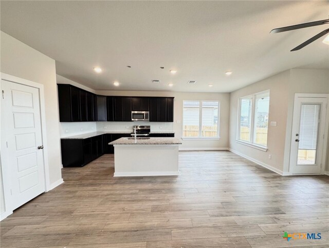 unfurnished room with ceiling fan, lofted ceiling, and carpet