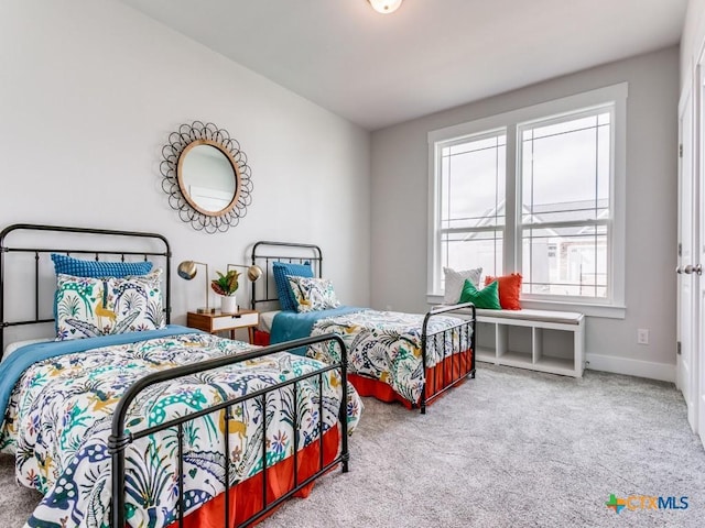 bedroom featuring multiple windows and carpet floors