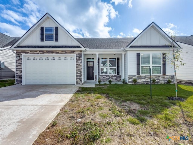 175 Lost Maples Way, Marion, TX 78124 - view of front of house featuring board and batten siding, stone siding, a front lawn, driveway, and an attached garage