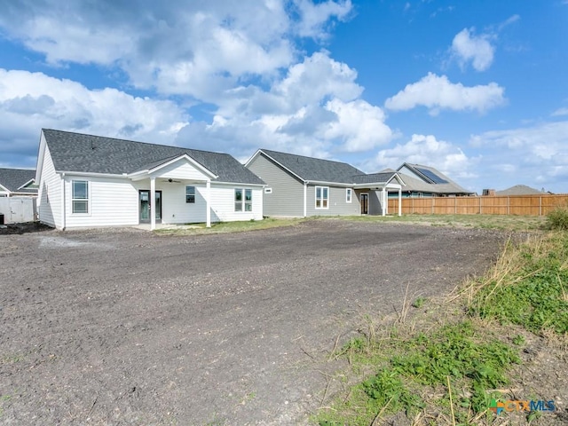 175 Lost Maples Way, Marion, TX 78124 - view of front of home featuring driveway, a ceiling fan, and roof with shingles