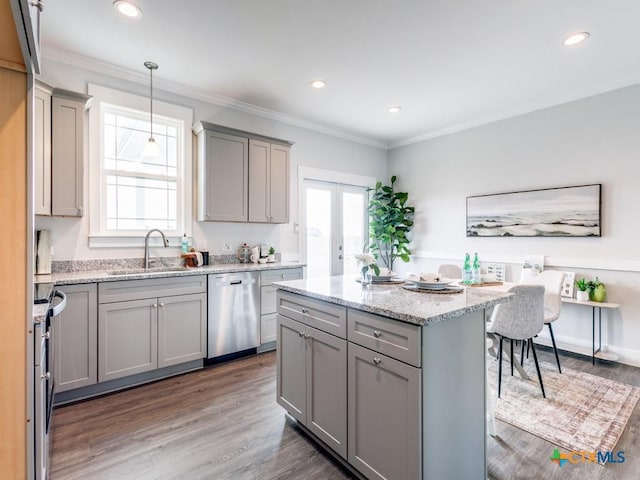 kitchen featuring dishwasher, sink, dark hardwood / wood-style flooring, pendant lighting, and gray cabinets