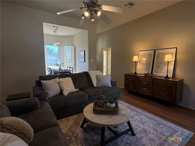 living room with hardwood / wood-style flooring and ceiling fan