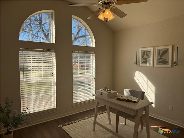 home office featuring high vaulted ceiling, hardwood / wood-style floors, and ceiling fan