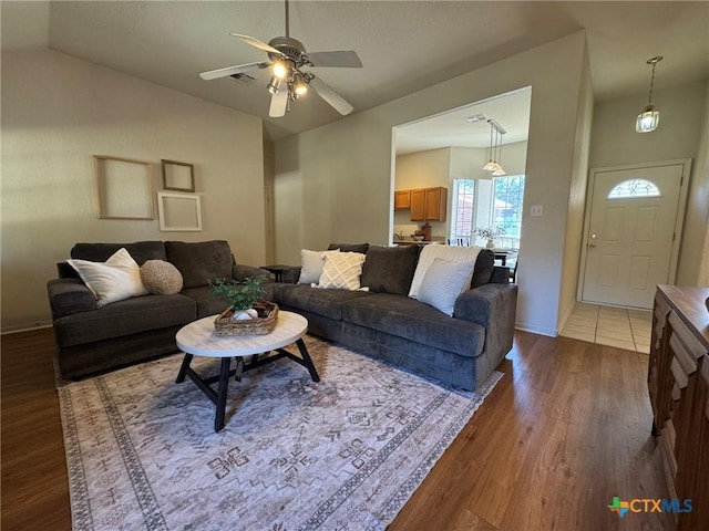 living room with hardwood / wood-style floors and ceiling fan