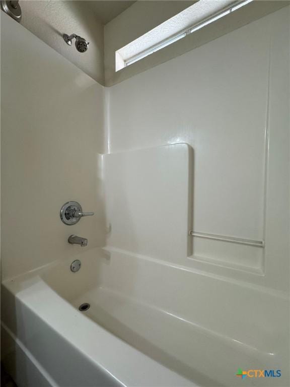 bathroom featuring washtub / shower combination