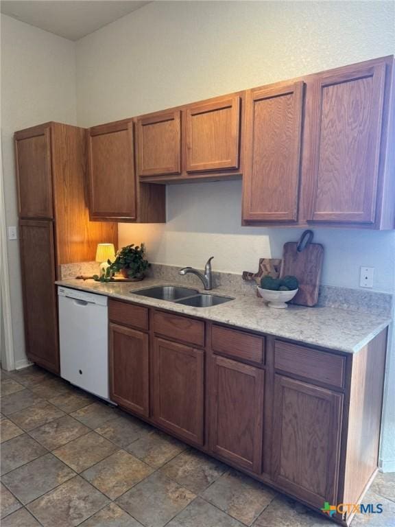 kitchen with white dishwasher and sink