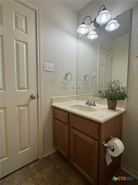 bathroom with vanity and tile patterned floors