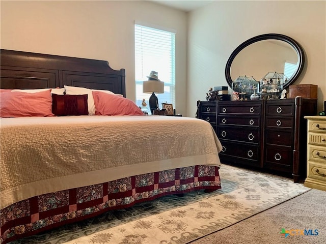 bedroom with light colored carpet