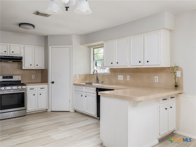 1304 Wroxton Way, Round Rock, TX 78664 - kitchen with gas stove, dishwasher, under cabinet range hood, a peninsula, and light countertops