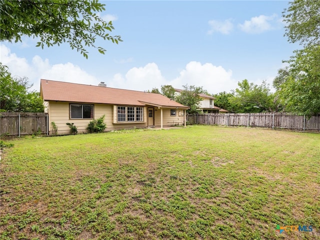 1304 Wroxton Way, Round Rock, TX 78664 - back of property with a fenced backyard and a patio area