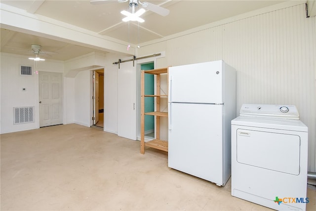 laundry area featuring a barn door, washer / clothes dryer, and ceiling fan