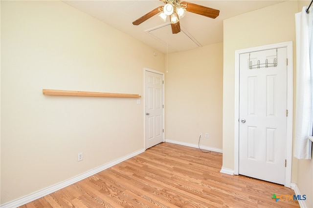 empty room featuring ceiling fan and light hardwood / wood-style floors