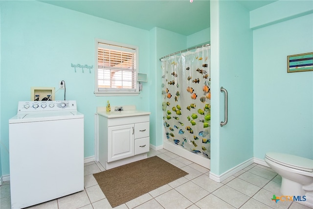 bathroom featuring a shower with shower curtain, tile patterned flooring, washer / dryer, and vanity