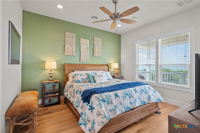 bedroom featuring ceiling fan and light wood-type flooring