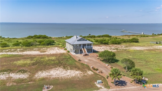 aerial view with a water view and a rural view