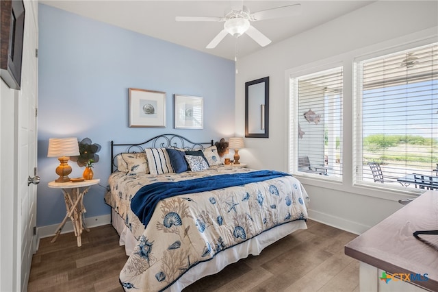 bedroom featuring hardwood / wood-style floors and ceiling fan