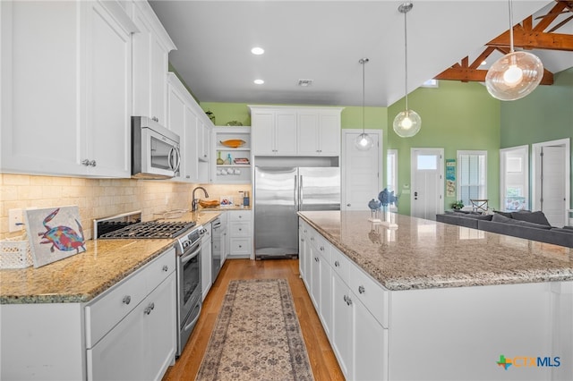 kitchen featuring white cabinetry and high quality appliances