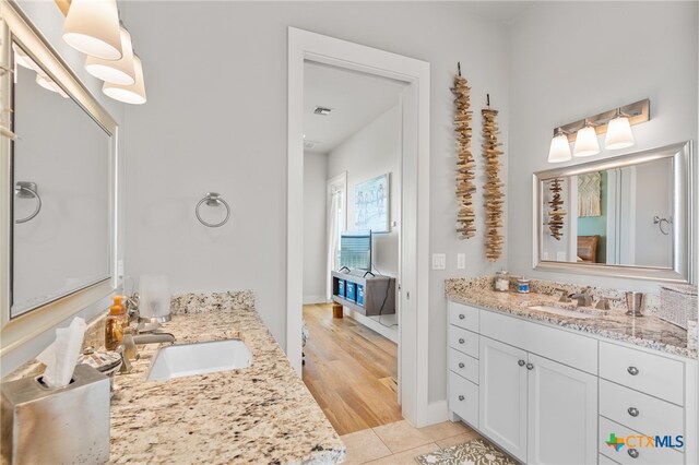 bathroom with vanity and hardwood / wood-style flooring