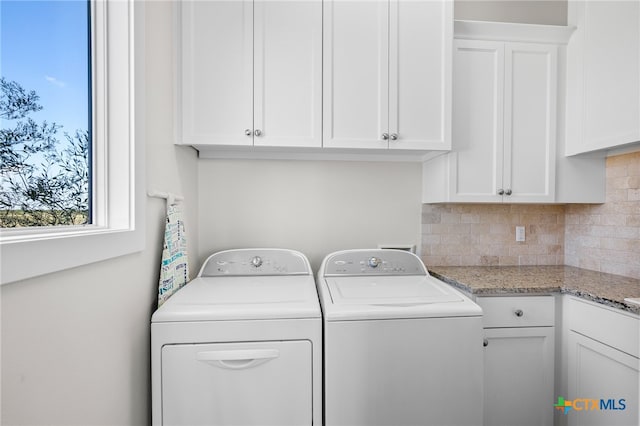 washroom with cabinets and independent washer and dryer