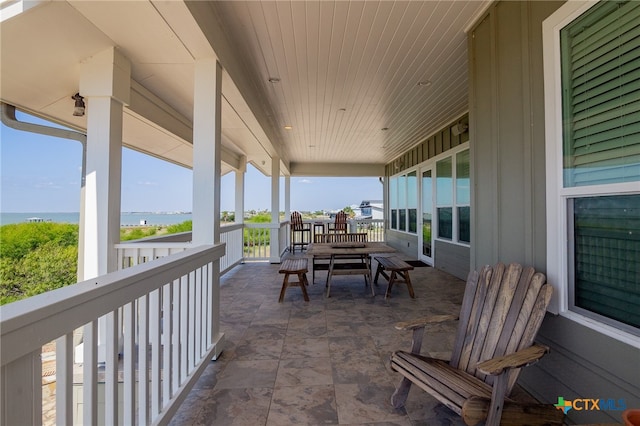 view of patio featuring a water view