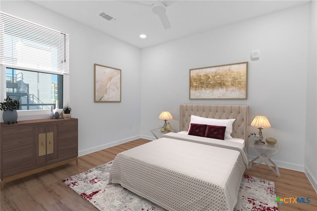 bedroom featuring wood-type flooring and ceiling fan