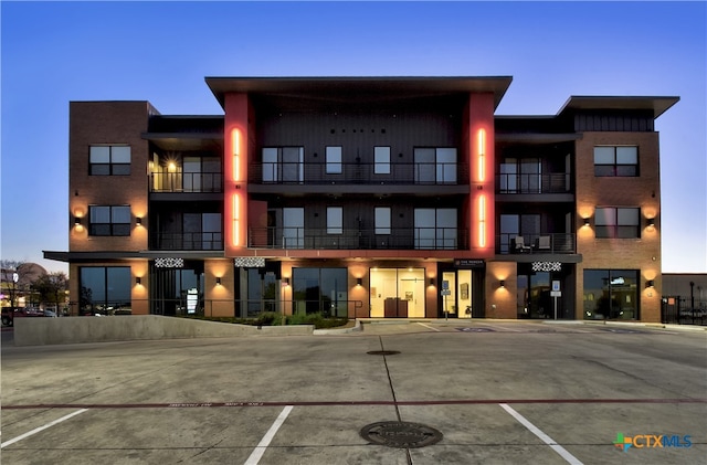 view of outdoor building at dusk