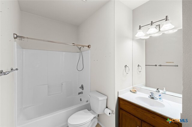 full bathroom with shower / washtub combination, vanity, and toilet