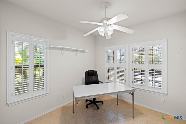 tiled home office with ceiling fan