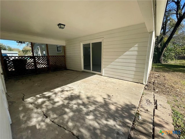 view of patio / terrace featuring fence