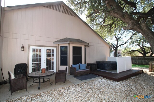 back of house featuring french doors, outdoor lounge area, and a patio area