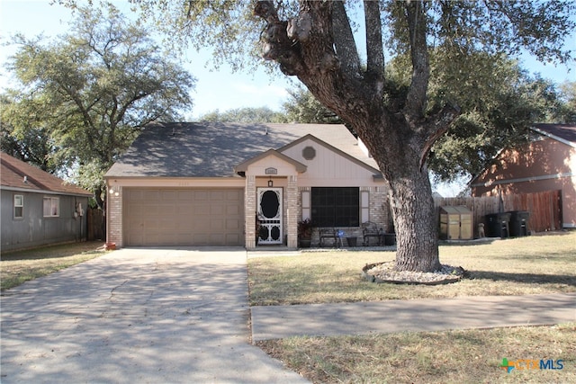 single story home featuring a front lawn and a garage