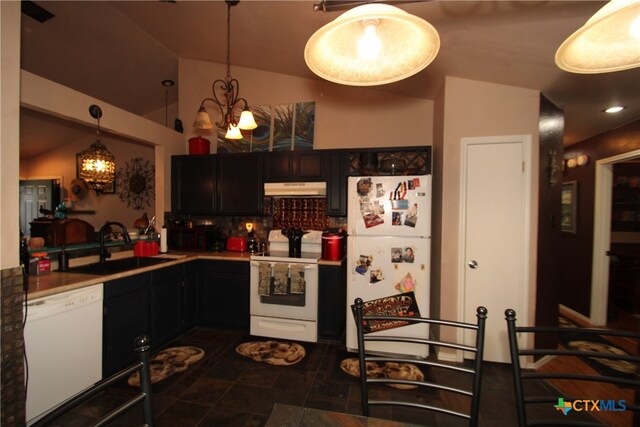 kitchen featuring an inviting chandelier, decorative backsplash, sink, pendant lighting, and white appliances