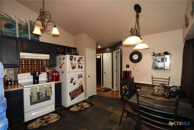 kitchen with white appliances, decorative backsplash, decorative light fixtures, and lofted ceiling