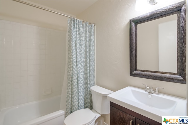 full bathroom featuring vanity, toilet, and shower / bath combination with curtain